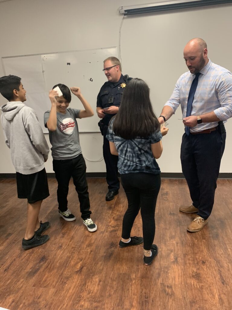 Law enforcement playing with kids