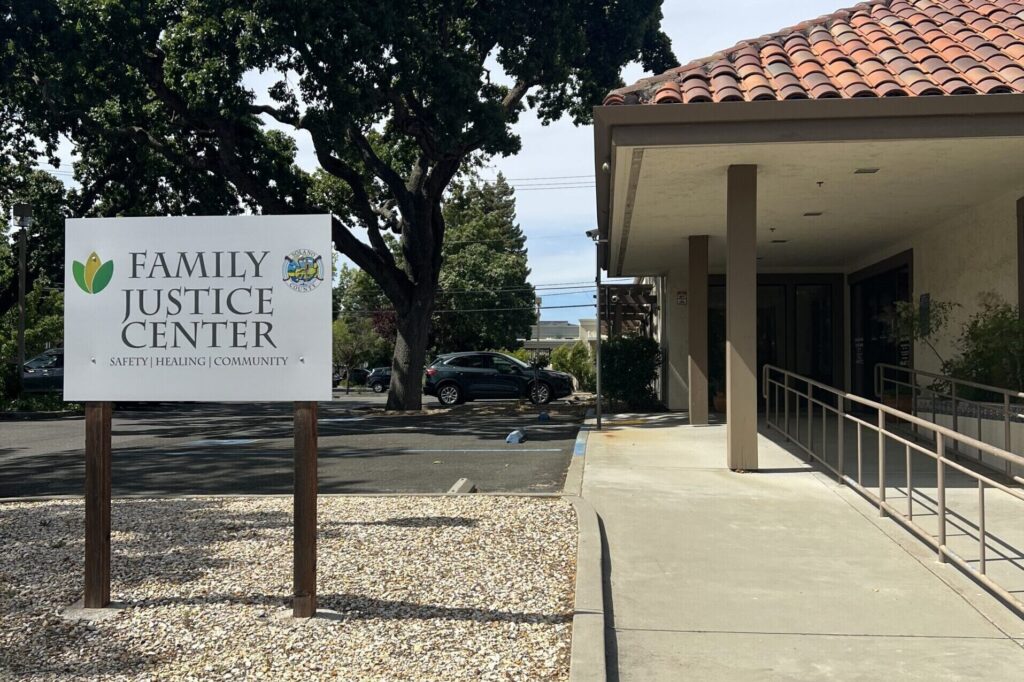 Front entrance of the Fairfield Family Justice Center with it's sign and pathway leading to the entrance